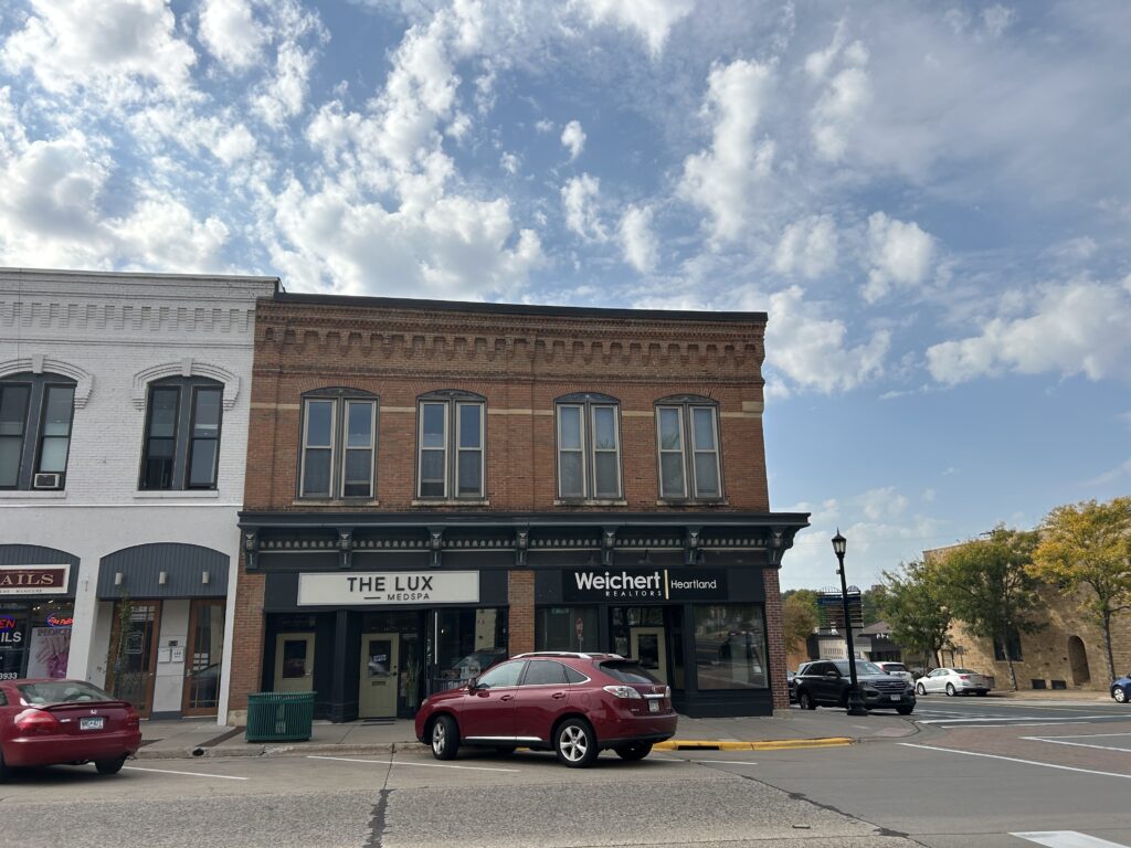 Old brick building on the corner of an intersection in downtown Northfield